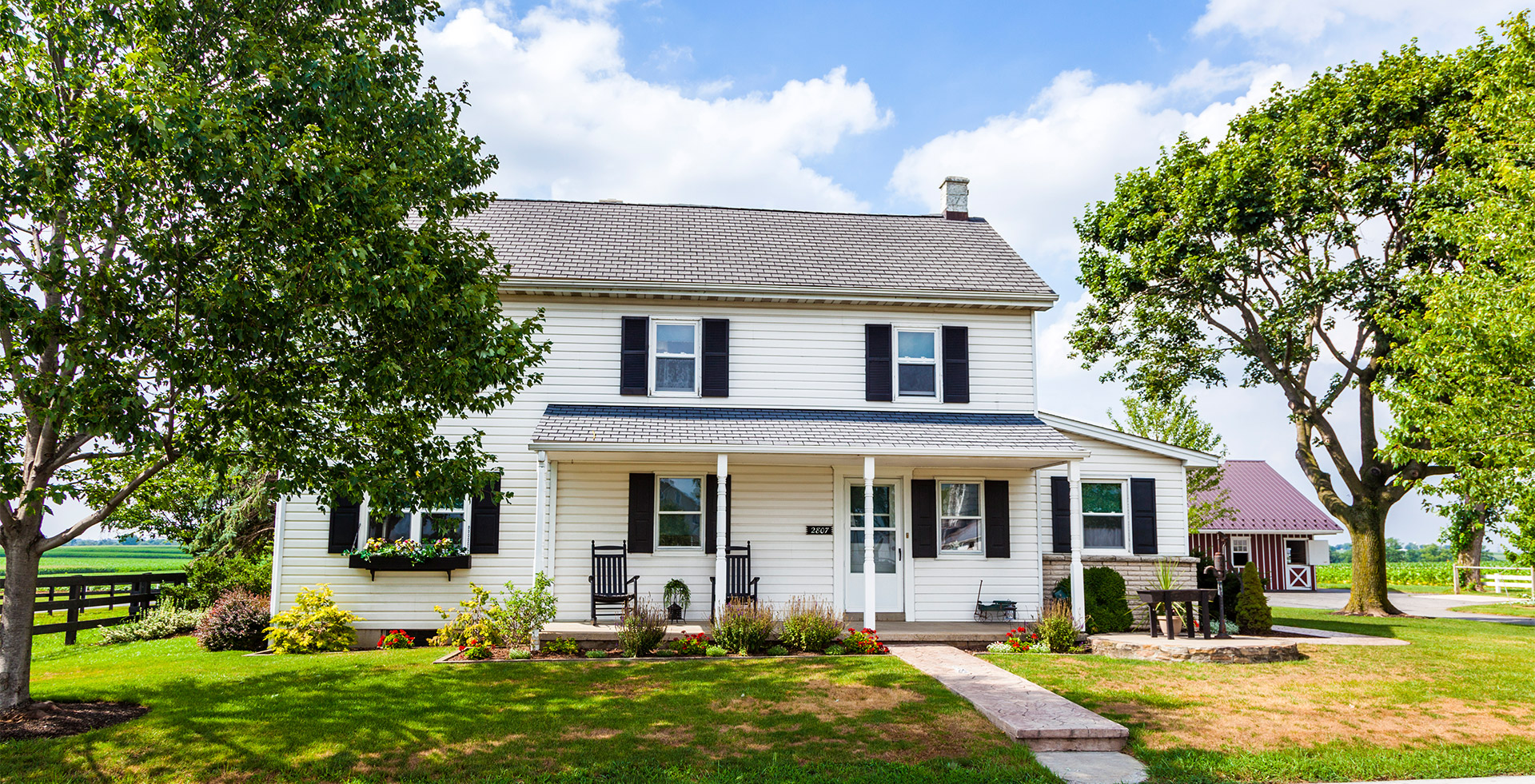 a house with bushes in front of a building